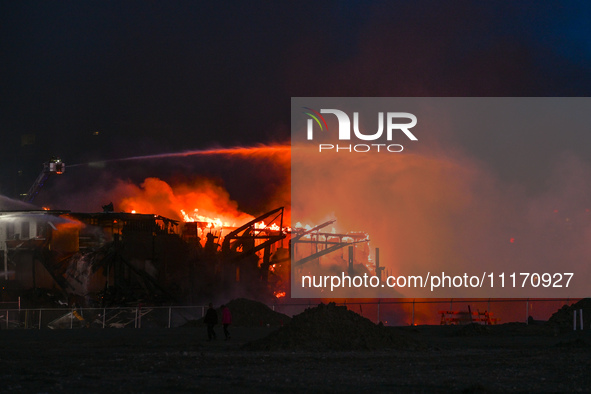 EDMONTON, CANADA - APRIL 22:
Several units of firefighters combat flames that tore through Edmonton's historic Hangar 11 on Monday evening,...