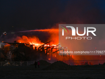 EDMONTON, CANADA - APRIL 22:
Several units of firefighters combat flames that tore through Edmonton's historic Hangar 11 on Monday evening,...