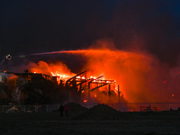 EDMONTON, CANADA - APRIL 22:
Several units of firefighters combat flames that tore through Edmonton's historic Hangar 11 on Monday evening,...