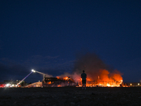 EDMONTON, CANADA - APRIL 22:
Local man approaches the fire site, risking his health as several units of firefighters combat the flames that...