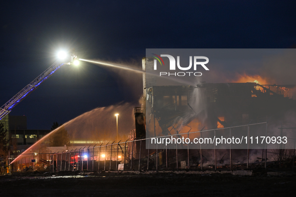 EDMONTON, CANADA - APRIL 22:
Several units of firefighters combat flames that tore through Edmonton's historic Hangar 11 on Monday evening,...