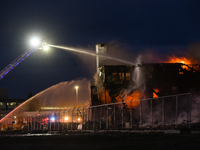 EDMONTON, CANADA - APRIL 22:
Several units of firefighters combat flames that tore through Edmonton's historic Hangar 11 on Monday evening,...