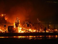 EDMONTON, CANADA - APRIL 22:
A local approaches the fire site, risking his health as several units of firefighters combat the flames that to...