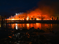 EDMONTON, CANADA - APRIL 22:
Local approach the fire site, risking his health as several units of firefighters combat the flames that tore t...