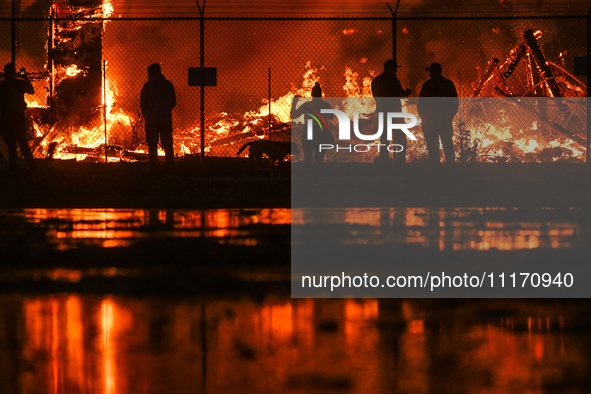 EDMONTON, CANADA - APRIL 22:
Local approach the fire site, risking his health as several units of firefighters combat the flames that tore t...