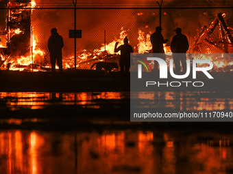 EDMONTON, CANADA - APRIL 22:
Local approach the fire site, risking his health as several units of firefighters combat the flames that tore t...