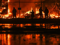 EDMONTON, CANADA - APRIL 22:
Local approach the fire site, risking his health as several units of firefighters combat the flames that tore t...