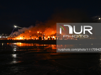 EDMONTON, CANADA - APRIL 22:
Local approach the fire site, risking his health as several units of firefighters combat the flames that tore t...