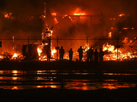 EDMONTON, CANADA - APRIL 22:
Local approach the fire site, risking his health as several units of firefighters combat the flames that tore t...