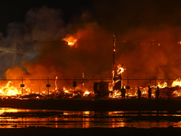 EDMONTON, CANADA - APRIL 22:
Local approach the fire site, risking his health as several units of firefighters combat the flames that tore t...