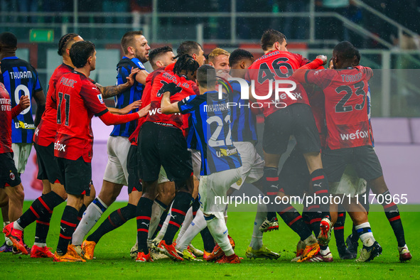 Players are fighting during the AC Milan versus FC Internazionale Serie A match at Giuseppe Meazza Stadium in Milan, Italy, on April 22, 202...