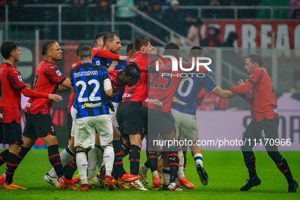 Players are fighting during the AC Milan versus FC Internazionale Serie A match at Giuseppe Meazza Stadium in Milan, Italy, on April 22, 202...