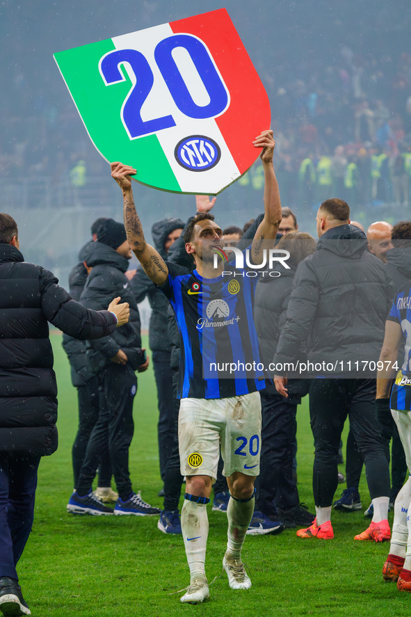 Hakan Calhanoglu is celebrating the championship during the AC Milan versus FC Internazionale match in Serie A at Giuseppe Meazza Stadium in...