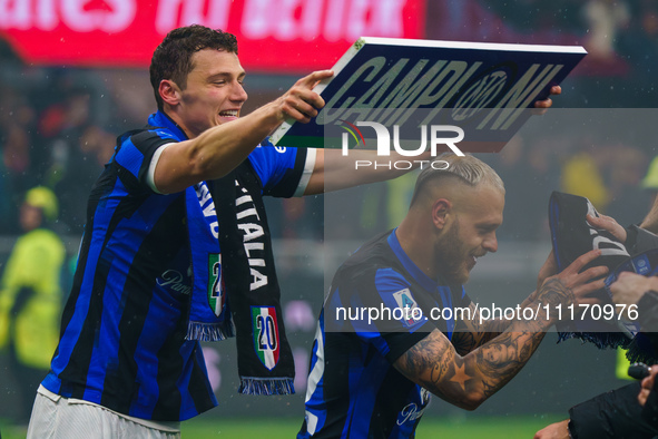 Benjamin Pavard and Federico Dimarco are celebrating during the AC Milan versus FC Internazionale match in Serie A at Giuseppe Meazza Stadiu...