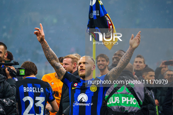 Federico Dimarco is celebrating during the match between AC Milan and FC Internazionale in Serie A at Giuseppe Meazza Stadium in Milan, Ital...