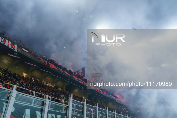 Supporters of AC Milan are cheering during the match between AC Milan and FC Internazionale in Serie A at Giuseppe Meazza Stadium in Milan,...