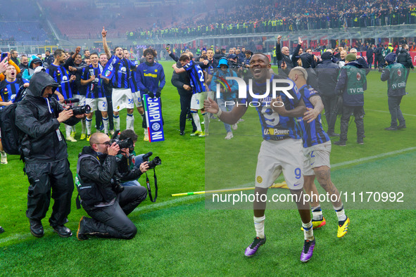 Marcus Thuram is celebrating during the AC Milan versus FC Internazionale match in the Serie A at Giuseppe Meazza Stadium in Milan, Italy, o...