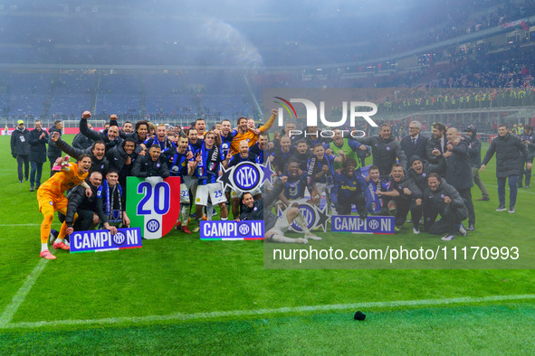 The FC Inter team is celebrating their championship during the match against AC Milan in the Serie A at Giuseppe Meazza Stadium in Milan, It...