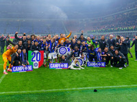 The FC Inter team is celebrating their championship during the match against AC Milan in the Serie A at Giuseppe Meazza Stadium in Milan, It...