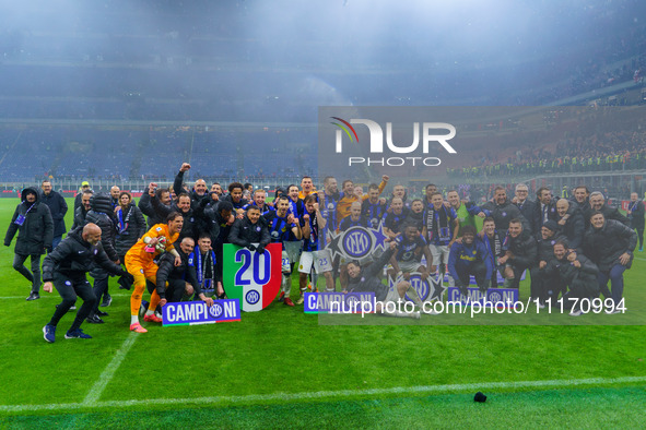 The FC Inter team is celebrating their championship during the match against AC Milan in the Serie A at Giuseppe Meazza Stadium in Milan, It...