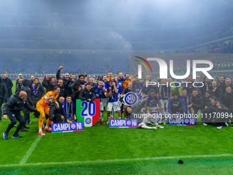 The FC Inter team is celebrating their championship during the match against AC Milan in the Serie A at Giuseppe Meazza Stadium in Milan, It...