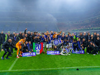 The FC Inter team is celebrating their championship during the match against AC Milan in the Serie A at Giuseppe Meazza Stadium in Milan, It...