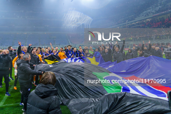 The FC Inter team is celebrating their championship during the match against AC Milan in the Serie A at Giuseppe Meazza Stadium in Milan, It...