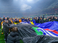 The FC Inter team is celebrating their championship during the match against AC Milan in the Serie A at Giuseppe Meazza Stadium in Milan, It...