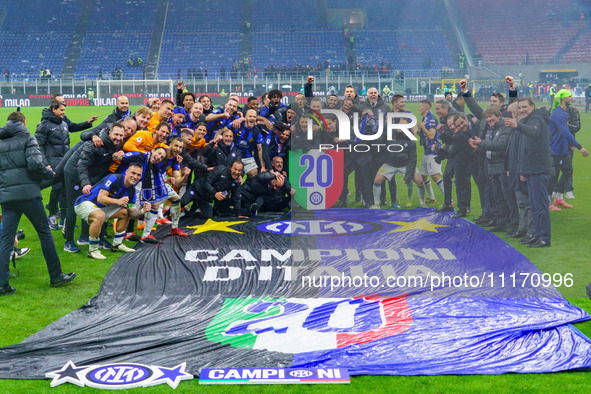 The FC Inter team is celebrating their championship during the match against AC Milan in the Serie A at Giuseppe Meazza Stadium in Milan, It...