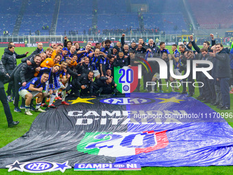 The FC Inter team is celebrating their championship during the match against AC Milan in the Serie A at Giuseppe Meazza Stadium in Milan, It...