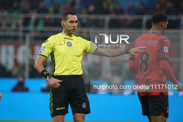 Referee Andrea Colombo is officiating the match between AC Milan and FC Internazionale in the Serie A at Giuseppe Meazza Stadium on April 22...