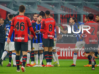 Hakan Calhanoglu and Ruben Loftus-Cheek are playing during the AC Milan versus FC Internazionale Serie A match at Giuseppe Meazza Stadium in...