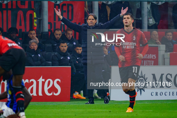 Simone Inzaghi, Head Coach of FC Inter, is watching the game between AC Milan and FC Internazionale in the Serie A at Giuseppe Meazza Stadiu...