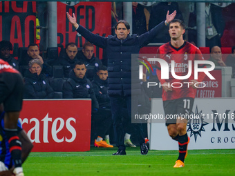 Simone Inzaghi, Head Coach of FC Inter, is watching the game between AC Milan and FC Internazionale in the Serie A at Giuseppe Meazza Stadiu...