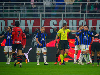 Referee Andrea Colombo is officiating the match between AC Milan and FC Internazionale in the Serie A at Giuseppe Meazza Stadium on April 22...