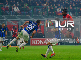 Rafael Leao and Benjamin Pavard are playing during the AC Milan versus FC Internazionale match in Serie A at Giuseppe Meazza Stadium on Apri...