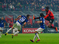 Rafael Leao and Benjamin Pavard are playing during the AC Milan versus FC Internazionale match in Serie A at Giuseppe Meazza Stadium on Apri...