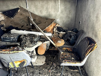 Burnt-out furniture is visible in a residential building that was damaged by a nighttime Russian drone attack in Odesa, Ukraine, on April 23...