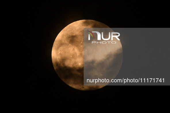 The 'Pink Moon,' which is April's full Moon, is being seen from Nagaon District, Assam, India, on April 23, 2024. 