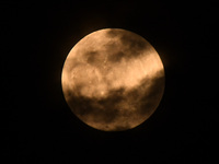 The 'Pink Moon,' which is April's full Moon, is being seen from Nagaon District, Assam, India, on April 23, 2024. (