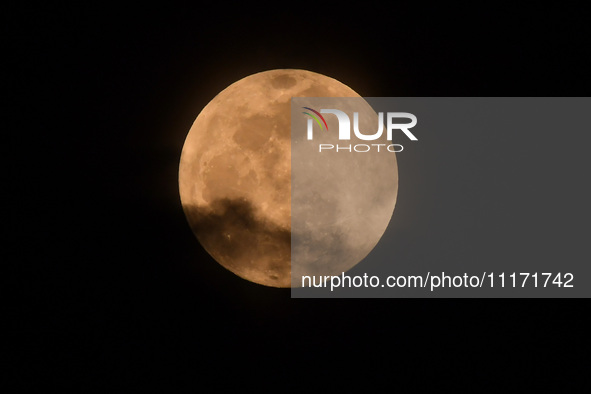 The 'Pink Moon,' which is April's full Moon, is being seen from Nagaon District, Assam, India, on April 23, 2024. 