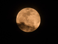 The 'Pink Moon,' which is April's full Moon, is being seen from Nagaon District, Assam, India, on April 23, 2024. (