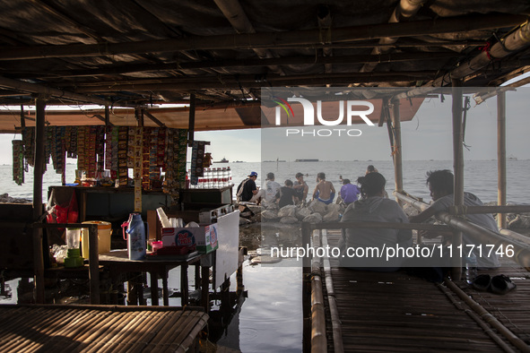 People are enjoying their holiday at Marunda public beach on the north coast of Jakarta, Indonesia, on April 23, 2024. Marunda Beach is the...