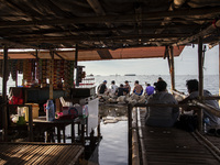 People are enjoying their holiday at Marunda public beach on the north coast of Jakarta, Indonesia, on April 23, 2024. Marunda Beach is the...