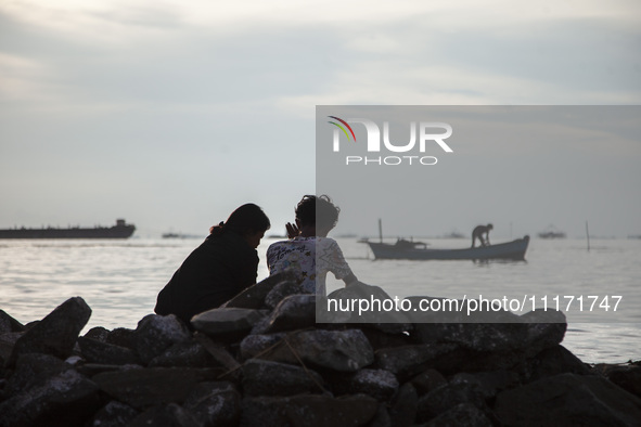 People are enjoying their holiday at Marunda public beach on the north coast of Jakarta, Indonesia, on April 23, 2024. Marunda Beach is the...