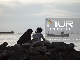 People are enjoying their holiday at Marunda public beach on the north coast of Jakarta, Indonesia, on April 23, 2024. Marunda Beach is the...