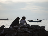 People are enjoying their holiday at Marunda public beach on the north coast of Jakarta, Indonesia, on April 23, 2024. Marunda Beach is the...