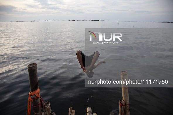 People are enjoying their holiday at Marunda public beach on the north coast of Jakarta, Indonesia, on April 23, 2024. Marunda Beach is the...