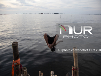 People are enjoying their holiday at Marunda public beach on the north coast of Jakarta, Indonesia, on April 23, 2024. Marunda Beach is the...