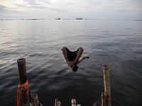 People are enjoying their holiday at Marunda public beach on the north coast of Jakarta, Indonesia, on April 23, 2024. Marunda Beach is the...